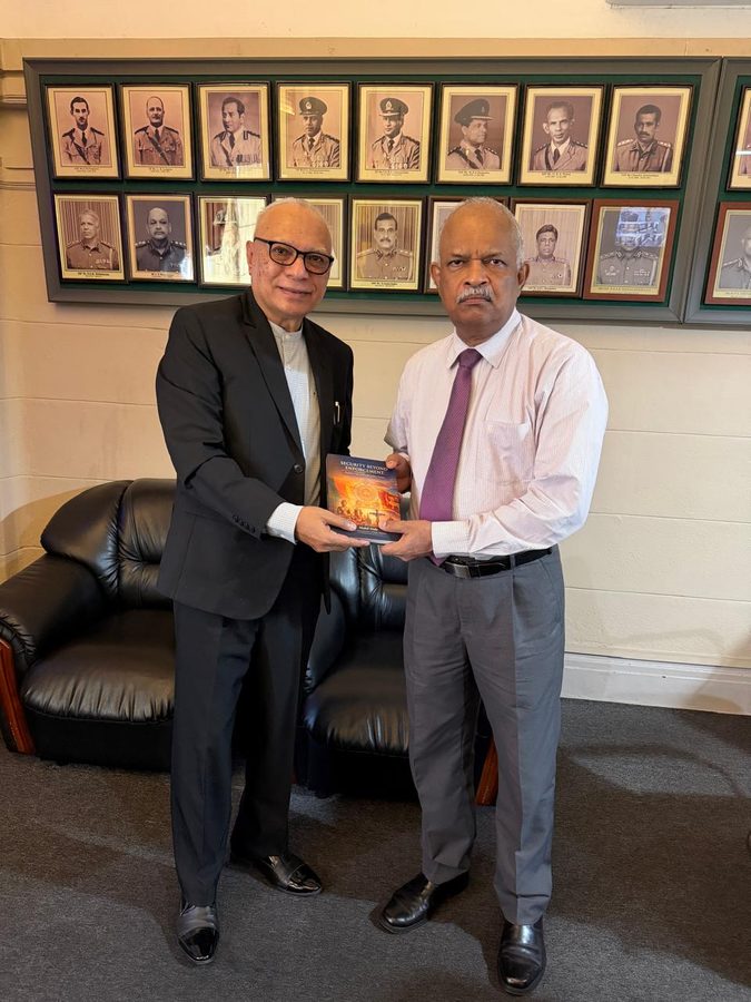 Mahil Dole handing over Security Beyond Enforcement to the Director CID